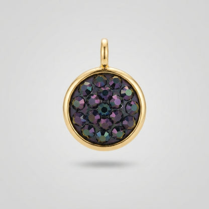 A round gold pendant charm featuring a pavé setting of faceted iridescent gemstones that shift between purple, green, and blue, set against a light gray background.
