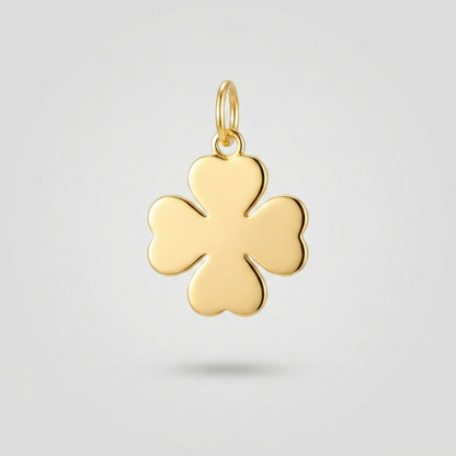 A polished yellow gold four-leaf clover charm pendant with a small top loop, shown against a light gray background.
